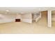 Spacious finished basement with carpeting, wainscoting, and staircase leading to the upper level at 611 Mill Farm Rd, Noblesville, IN 46062