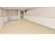 Finished basement showcasing neutral carpet and wainscoting, providing a versatile living area at 611 Mill Farm Rd, Noblesville, IN 46062