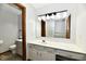 This bright bathroom features a white vanity with a sink, a mirror, and a toilet at 611 Mill Farm Rd, Noblesville, IN 46062