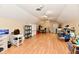 Large finished bonus room with wood flooring and ample natural light at 611 Mill Farm Rd, Noblesville, IN 46062