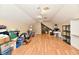 Large finished bonus room with wood flooring and ample natural light at 611 Mill Farm Rd, Noblesville, IN 46062