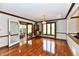 Elegant dining room with hardwood floors, a chandelier, and access to an outdoor deck at 611 Mill Farm Rd, Noblesville, IN 46062