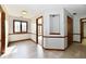 Hallway with beautiful trim and recessed shelving, offering a glimpse into other rooms at 611 Mill Farm Rd, Noblesville, IN 46062