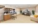 Bright home office with two work areas, modern desks, and a comfortable sofa at 611 Mill Farm Rd, Noblesville, IN 46062