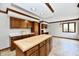 Open kitchen design featuring wood cabinets, an island, and natural light at 611 Mill Farm Rd, Noblesville, IN 46062