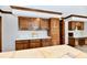 Classic kitchen showcasing wood cabinets, white countertops, and ample storage at 611 Mill Farm Rd, Noblesville, IN 46062