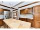 Bright kitchen featuring a tiled island, stainless steel appliances, and wood cabinets at 611 Mill Farm Rd, Noblesville, IN 46062