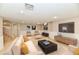 Spacious basement living room with a large TV, comfortable seating, and modern decor at 611 Mill Farm Rd, Noblesville, IN 46062