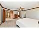 Main bedroom featuring neutral carpet, wood trim, and adjoining rooms for convenience at 611 Mill Farm Rd, Noblesville, IN 46062