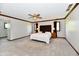 Spacious main bedroom with large windows, neutral carpet, and contemporary ceiling fan at 611 Mill Farm Rd, Noblesville, IN 46062