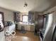 Functional kitchen with built in cabinets, stainless steel appliances, and a simple layout at 629 E 32Nd St, Anderson, IN 46016