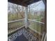 Charming balcony with view of a stream and lush greenery at 6525 Emerald Hill Ct # 208, Indianapolis, IN 46237