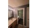 Bathroom with a vanity, ample lighting, and a neutral color scheme at 6525 Emerald Hill Ct # 208, Indianapolis, IN 46237