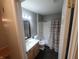 Neat bathroom with single vanity, toilet, and shower-tub combo with curtain at 6525 Emerald Hill Ct # 208, Indianapolis, IN 46237