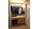 Bathroom vanity, featuring wood cabinetry, a mirror, and a sink with ample lighting at 6525 Emerald Hill Ct # 208, Indianapolis, IN 46237
