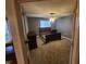 A neutral carpeted bedroom with wooden furniture and a ceiling fan for comfort and style at 6525 Emerald Hill Ct # 208, Indianapolis, IN 46237