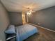 Bright bedroom featuring soft carpeting, gray walls, and a lit ceiling fan at 6525 Emerald Hill Ct # 208, Indianapolis, IN 46237