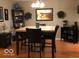 Comfortable dining area with wooden table, chairs, and decorative accents at 6525 Emerald Hill Ct # 208, Indianapolis, IN 46237