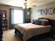 Serene bedroom with a large bed, neutral decor, and natural light from the window at 6525 Emerald Hill Ct # 208, Indianapolis, IN 46237