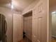 Walk-in pantry with shelving for ample storage adjacent to a stainless steel refrigerator at 6525 Emerald Hill Ct # 208, Indianapolis, IN 46237