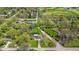 An aerial view displaying a charming home and verdant landscaping within a tranquil neighborhood near the golf course at 7205 Steven Ln, Indianapolis, IN 46260