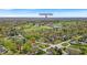 Aerial view shows a golf course and homes with Broad Ripple Village and the Meridian Hills Country Club nearby at 7205 Steven Ln, Indianapolis, IN 46260