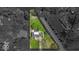 An overhead view shows the layout of the property highlighting its spacious, well-maintained yard in a suburban setting at 7205 Steven Ln, Indianapolis, IN 46260