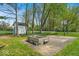 Spacious backyard with a shed, basketball court, and room for outdoor activities at 7205 Steven Ln, Indianapolis, IN 46260