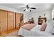 Comfortable bedroom with hardwood floors, ceiling fan, and a cozy atmosphere at 7205 Steven Ln, Indianapolis, IN 46260