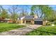 Well-maintained home with an expansive lawn and private driveway, perfect for suburban living and outdoor enjoyment at 7205 Steven Ln, Indianapolis, IN 46260