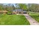 Well-maintained home with an expansive lawn and private driveway, perfect for suburban living and outdoor enjoyment at 7205 Steven Ln, Indianapolis, IN 46260