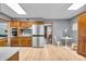 Kitchen area featuring stainless steel appliances, a dining area, and wood cabinets at 7205 Steven Ln, Indianapolis, IN 46260