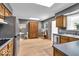 Spacious kitchen featuring stainless steel appliances, wood cabinets, and ample counter space at 7205 Steven Ln, Indianapolis, IN 46260