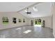 Bright, open living room with skylights, neutral tones, and easy access to outdoor spaces at 7205 Steven Ln, Indianapolis, IN 46260