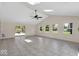 Airy living room with skylights, neutral palette, and seamless transition to outdoor entertaining at 7205 Steven Ln, Indianapolis, IN 46260