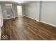 Finished basement area with new flooring, recessed lighting, and access to stairs at 7440 S 250 W, Pendleton, IN 46064