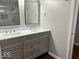 Modern bathroom featuring a double sink vanity with stylish fixtures and a framed mirror at 7440 S 250 W, Pendleton, IN 46064
