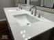 Modern bathroom sink featuring white countertop and sleek, brushed nickel fixtures at 7440 S 250 W, Pendleton, IN 46064