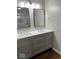 Modern bathroom featuring a double sink vanity with stylish fixtures and a framed mirror at 7440 S 250 W, Pendleton, IN 46064