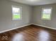 Cozy bedroom with two windows and hardwood flooring, perfect for relaxing and restful nights at 7440 S 250 W, Pendleton, IN 46064