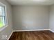 Cozy bedroom with hardwood floors and a bright window offering natural light at 7440 S 250 W, Pendleton, IN 46064