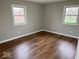 Cozy bedroom with hardwood floors and two bright windows offering natural light at 7440 S 250 W, Pendleton, IN 46064