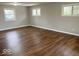 Bright bedroom with hardwood floors and three windows offering plenty of natural light at 7440 S 250 W, Pendleton, IN 46064