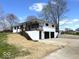Modern two-story home with attached garages, dark window frames, and a landscaped front yard at 7440 S 250 W, Pendleton, IN 46064