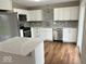 Renovated kitchen features stainless steel appliances, countertops, and stylish backsplash at 7440 S 250 W, Pendleton, IN 46064