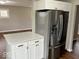 Contemporary kitchen featuring stainless steel appliances, white cabinets, and a center island at 7440 S 250 W, Pendleton, IN 46064