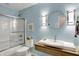 Bathroom featuring a tub, shower, and a unique vessel sink at 7728 Mallard Way, Indianapolis, IN 46256