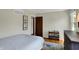 Bedroom featuring a bed, wood dresser, and wood flooring at 7728 Mallard Way, Indianapolis, IN 46256