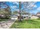 Charming two-story home featuring a blue front door, attached garage and manicured landscaping at 7728 Mallard Way, Indianapolis, IN 46256