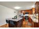 Modern eat-in kitchen with granite counters, center island, and stainless steel appliances at 7728 Mallard Way, Indianapolis, IN 46256